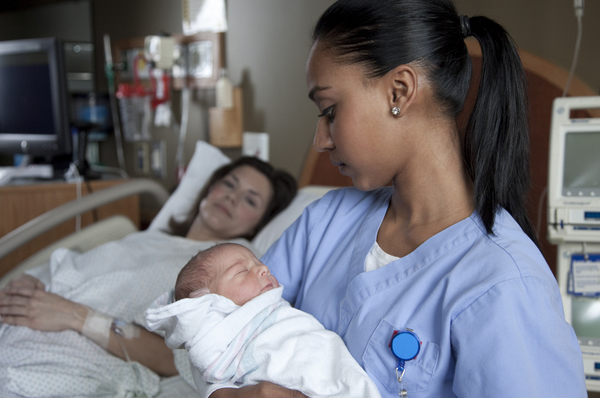  nurse carrying baby