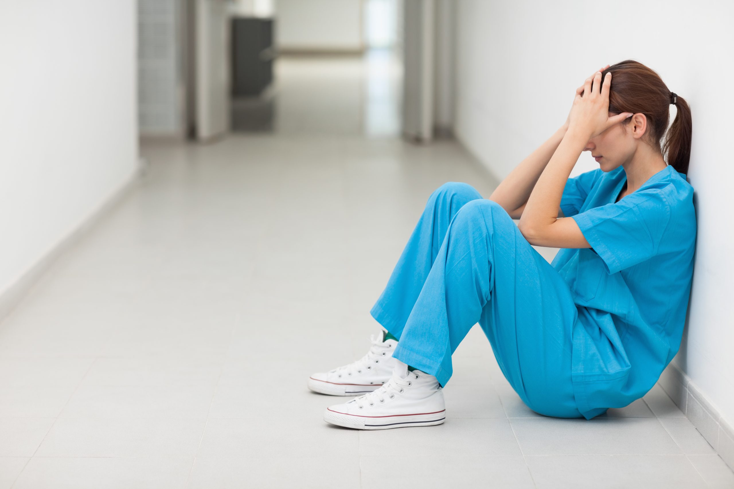 nurse sitting on the floor